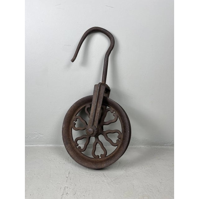 Heavy metal pulley from Japan. Beautifully designed and therefore very decorative. The wheel turns and the hook can also...