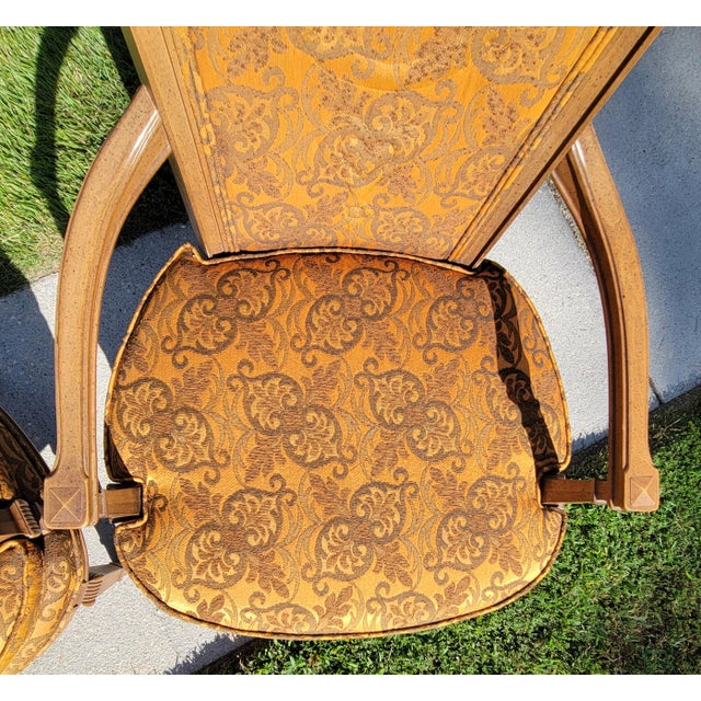 Made by Statesville chair company of North Carolina, these Louis XVI statement chairs feature carved, fluted fruitwood...