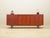 The sideboard was made in the 1970s, Danish production. The structure is covered with teak veneer. Legs made of solid wood...