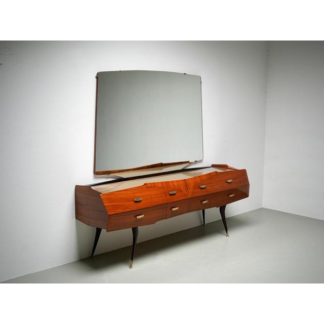 This Italian credenza with mirror from the 1960s is executed in the style of Vittorio Dassi and is characterized by its...