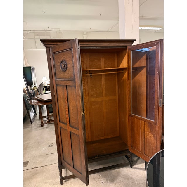 Design Plus Gallery presents an English Arts & Crafts Oak Armoire. Constructed with a tall rectangular case, the wardrobe...