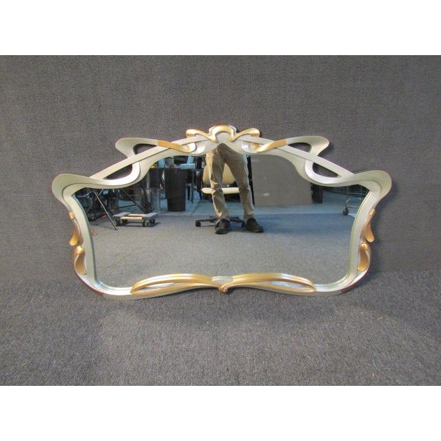 Warm and whimsical, this elegant wall mirror brims with vintage allure. Its fantasy-like approach and detailed curvature...