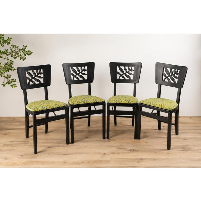 Set of 4 folding chairs, Stakmore, New York, circa 1930. 4 Stakmore-model folding chairs, made of blackened wood, from the...
