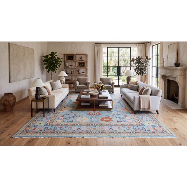 Elevate your space with this modern Oushak-style hand-knotted wool area rug, crafted with premium natural fibers for a...