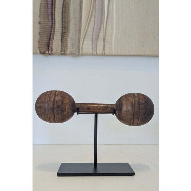 Antique Wooden Dumbbell on Iron Stand – Early 20th Century Gym Object This early 20th-century wooden dumbbell has been...