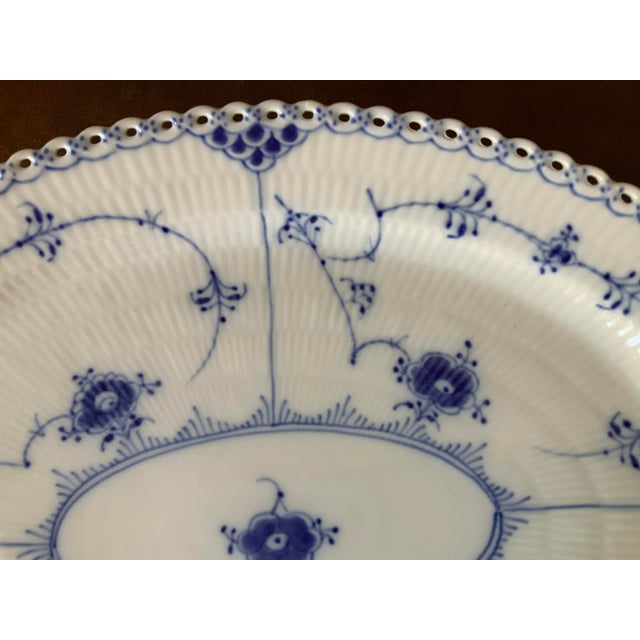 Iconic open work lace border along the entire rim; hand painted cobalt floral pattern;
