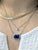 This large tanzanite pendant is a true showstopper—featuring a vivid 8.27-carat center stone surrounded by a shimmering...