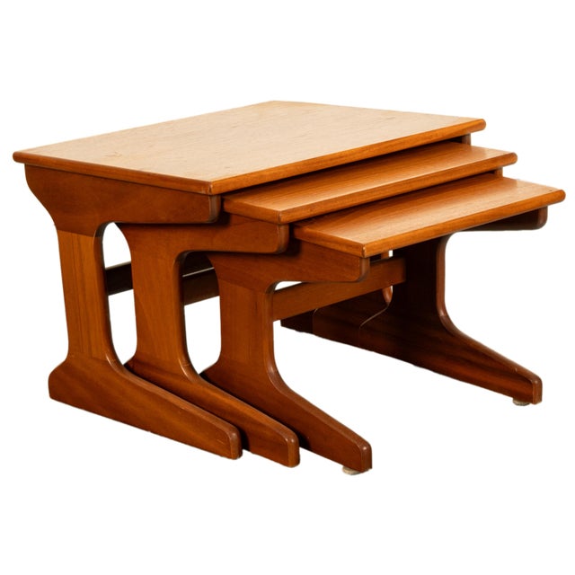 A good set of three Danish Mid Century Modern teak nesting side tables, circa 1965. This very stylish set of three teak...