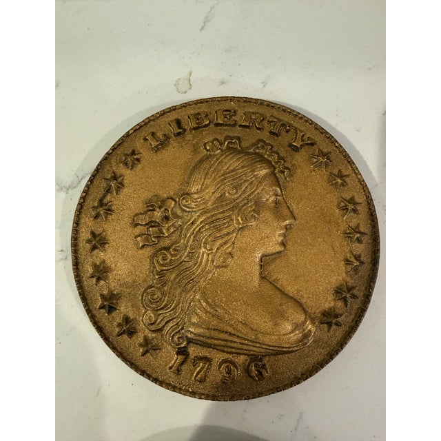 These items are decorative replicas of historical United States coins, such as the 1796 Liberty Cap cent or 1878 Liberty...