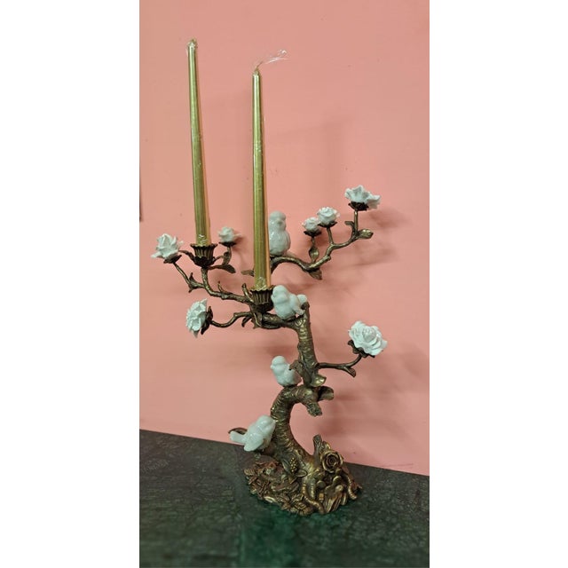 This is a magnificent candelabra of birds and flowers in white porcelain and gilt bronze (ormolu), elaborately crafted and...