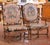 This elegant pair of antique French armchairs was crafted in walnut, circa 1870, and reflects the graceful curves and...