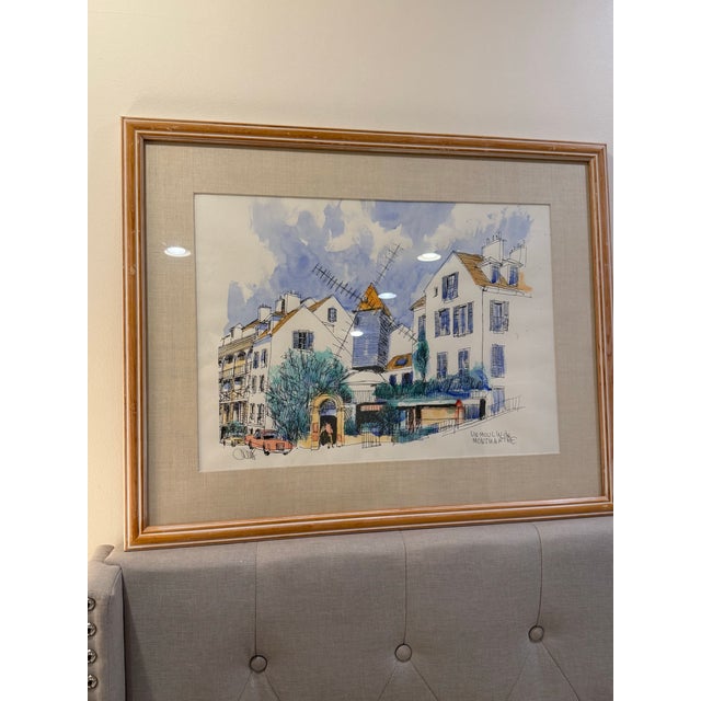 Framed Montmartre Windmill Scene – Paris Watercolor Description: Romantic Parisian scene featuring the iconic Montmartre...