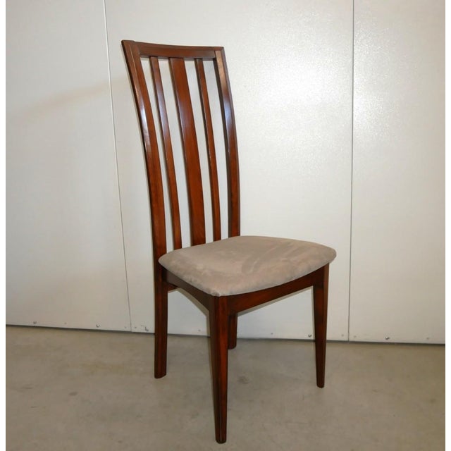 Six beech chairs, never used. New. Six beech chairs, stained brown, never used. New, from an Italian chair manufacturer...