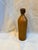 The bottle features a warm, naturally aged patina and a concave hand-formed base typical of 19th-century copperwork. The...