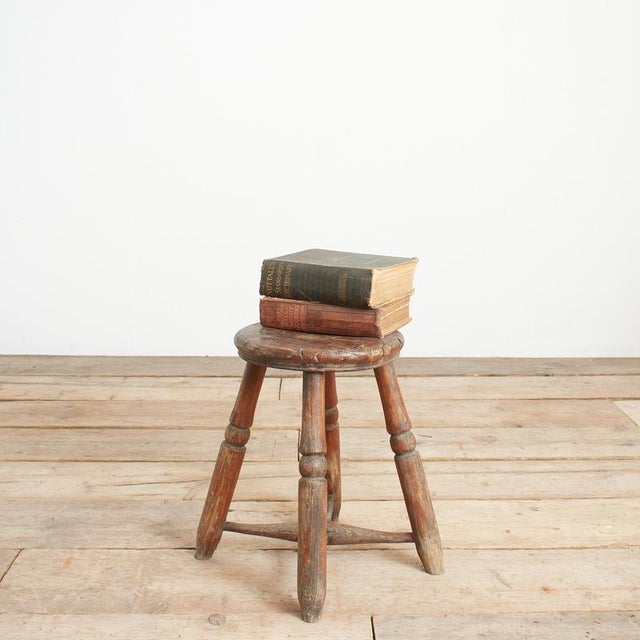 Rustic Wooden Milking Stool A charming antique stool made from solid pine originally used as a milking stool due to its...