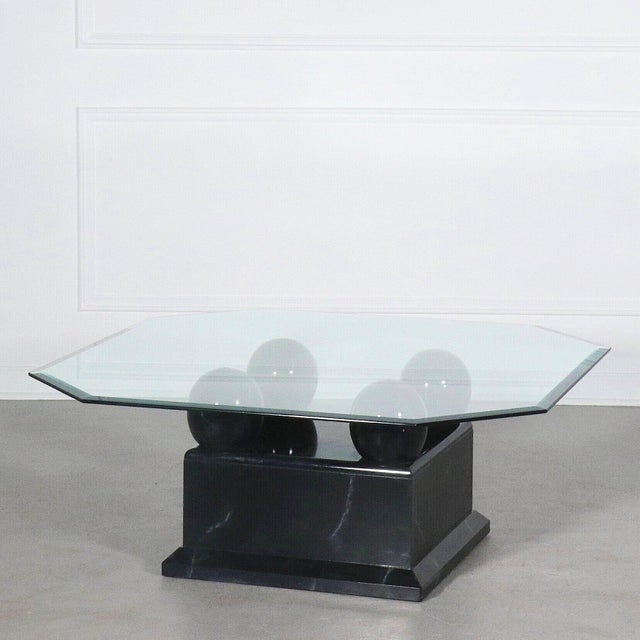 Modern faux black marble coffee table with 4 spheres holding glass top with beveled edge. Coordinating side table...