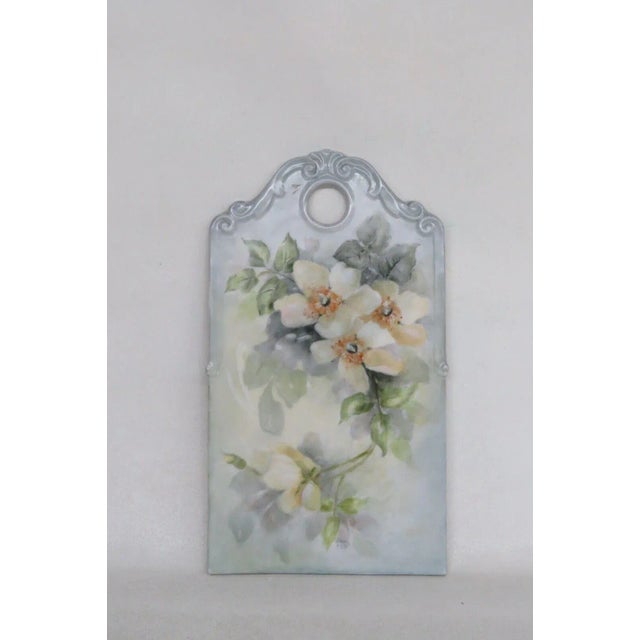 This gorgeous cutting board is made of ceramic. This piece features a beautiful hand painted design of yellow flowers on a...