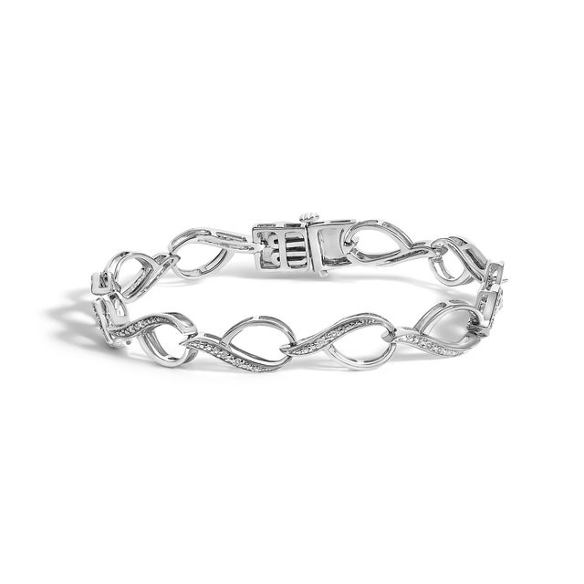 A whisper of light curls around your wrist in this graceful procession of open marquise leaves, each joined by a silken...