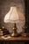 This elegant three-arm brass table lamp is a timeless example of mid-century traditional design, blending Hollywood...