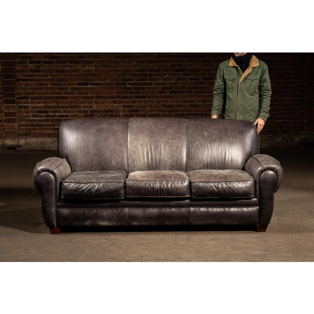 2004; Klaussner Furniture Industries - Asheboro, North Carolina Full-size upholstered sofa clad in black leather, built...
