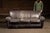 2004; Klaussner Furniture Industries - Asheboro, North Carolina Full-size upholstered sofa clad in black leather, built...