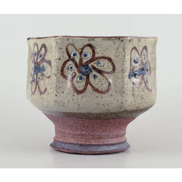 Birgit Krog, Danish ceramist. Unique hexagonal ceramic vase. Raku technique. Glazed and unglazed. Floral motifs. Brown and...