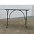 An exceptional French marble-topped garden table with industrial details in the cast iron base reflecting the style of the...
