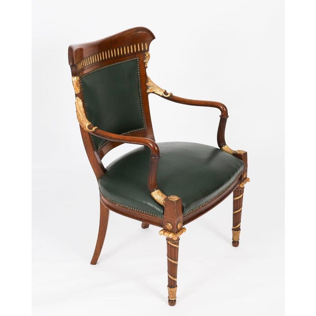 A superb antique set of fourteen French giltwood flame mahogany dining chairs, circa 1860 in date. The set consists of...