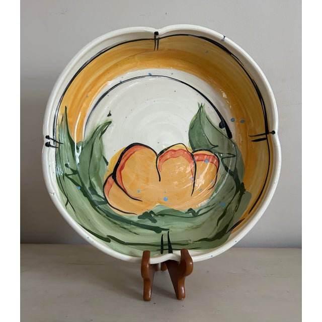 Large studio pottery decorative bowl by artist Donna Toohey. Features a modern abstract orange and green design with...