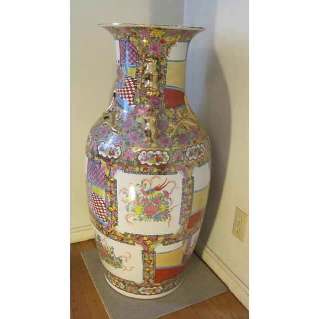 • Type: Chinese Famille Rose porcelain floor vase • Height: Approximately 37 inches • Opening Diameter: Approximately 13.5...