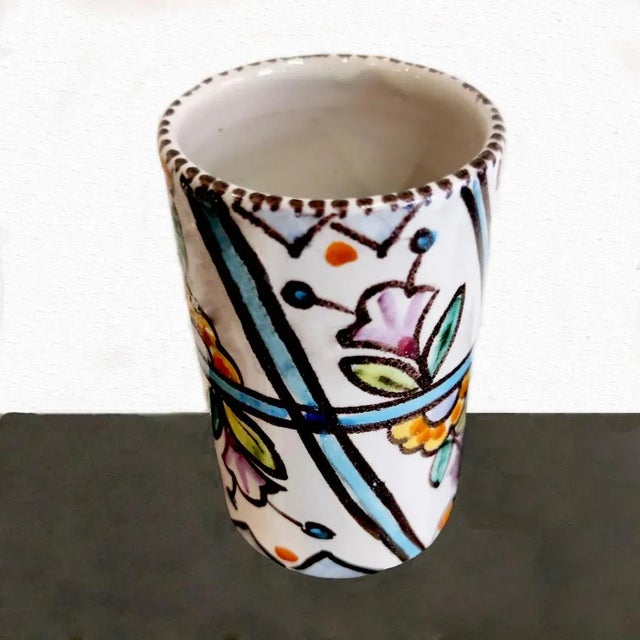 Vincenzo Pinto, Vietri, terracotta vase with polychrome floral decoration, h.cm. 13,5x8,5, year 1938. This piece has an...