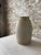 Beautiful handcrafted stoneware vase with an understated primitive silhouette and naturally weathered character. Finished...