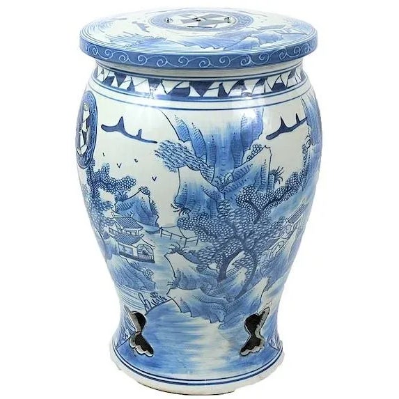 This is a beautiful blue and white porcelain garden stool in a "Baluster" shape stool with a canton village design around...
