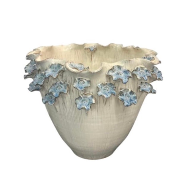 This artisanal vintage Italian ceramic planter features a tapered, urn-like silhouette crafted from pottery with a...