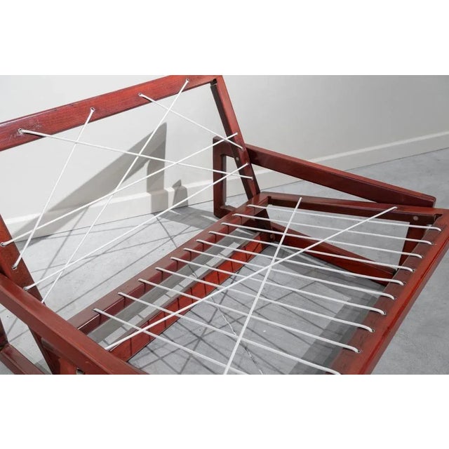 Pair of Italian single armchairs, model "Carlotta" with solid wood structure, four rectangles that form backrest and seat,...