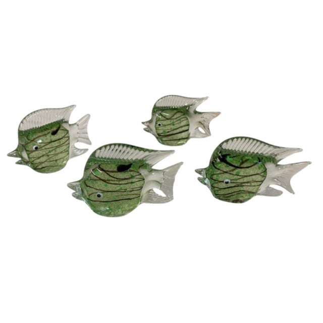 Enhance your home decor or art glass collection with this exquisite set of four vintage Italian hand-blown glass fish...