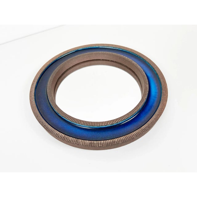 Vintage small ceramic circular mirror with blue glaze by Erik Reiff for Knabstrup. Burlap backing with manufacturers stamp...
