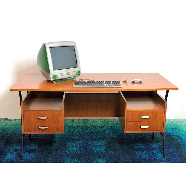 Large vintage executive desk from the 1960s, in a modernist style, Italian design. The desk is made of wood with teak...