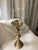 This substantial heavy vintage candlestick is crafted from solid brass and hails from the 1960s. It features a tiered...