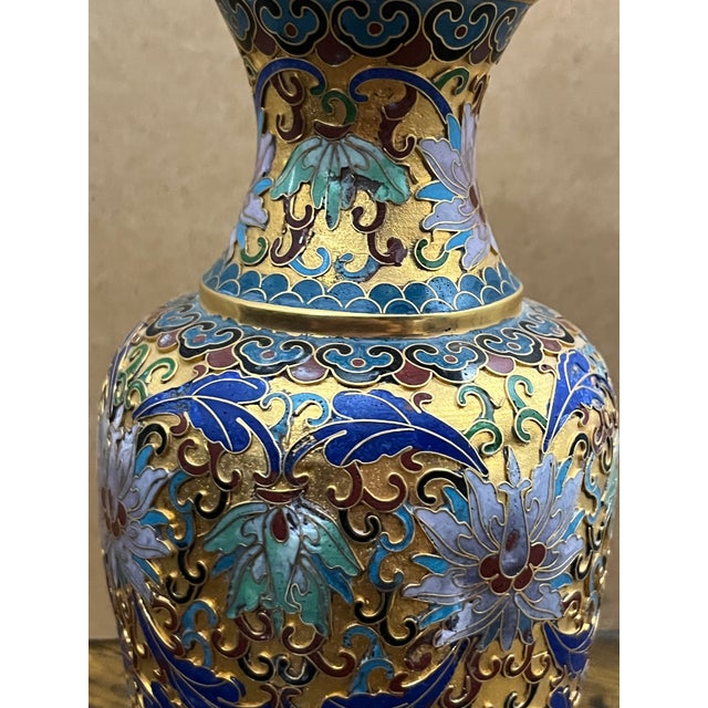 An elegant mid-century Chinese cloisonné enamel vase handcrafted over a gilt brass body. Decorated with intricate...