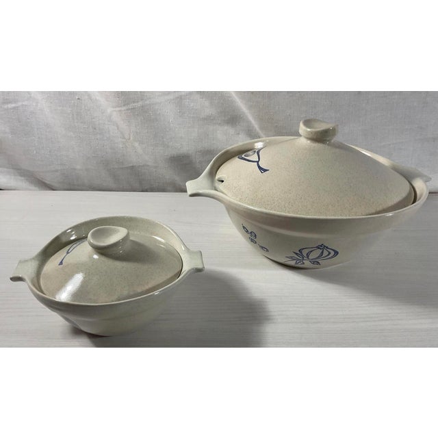 An absolute treasure for the mid-century modern kitchen collector! This is a rare, matching two-piece nested set of lidded...