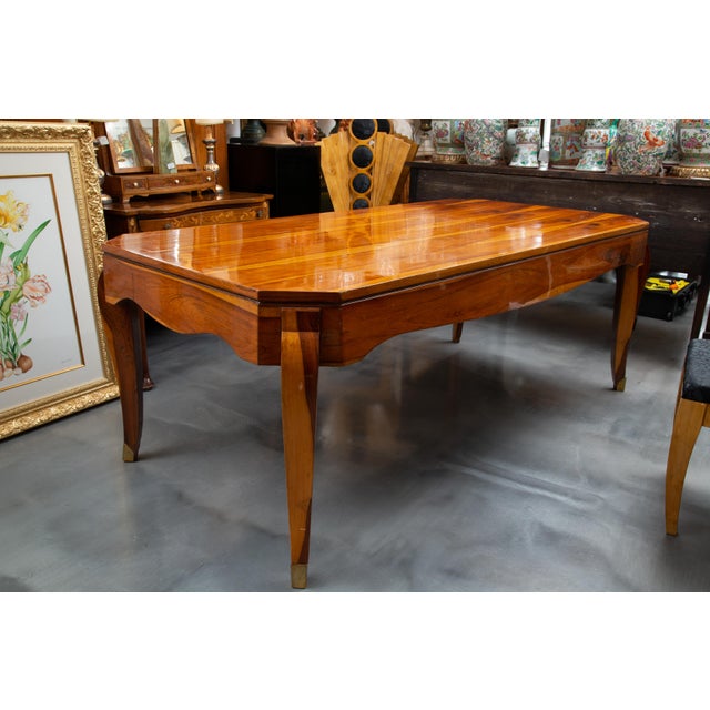 This is a unique Deco style dining table, made of an exotic wood and highly French polished. The top with straight edge is...