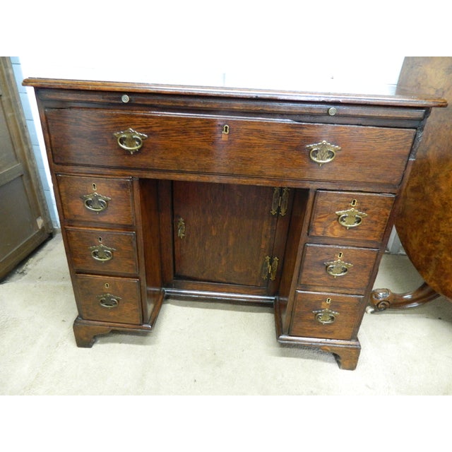The w.r. Simkin solid oak knee hole desk is a stunning antique piece crafted from oak. With a classic arts &...