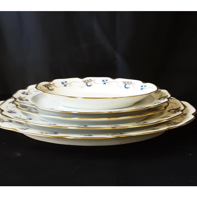 Set of five oval serving dishes, in various sizes. The smallest is actually an oval serving dish measuring 10"x 6" and...