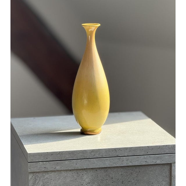 This elegantly tapered vase dates from the 1950s and was designed by the renowned Swedish ceramicist Berndt Friberg for...