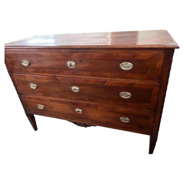 Neoclassical chest of drawers hand-made in Italy in the mid 1700s using walnut and decorated with walnut veneer. The...