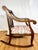 Classic vintage Empire style parlor rocking chair crafted in oak with a walnut finish. Made in the United States in the...