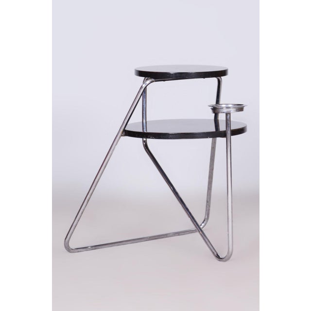 Table model Mn 7 This small smoking table from the 1930s is an unusual example of avant-garde modernist design in the...