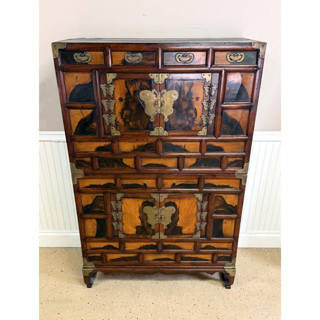 Known as Ich'ung Nong in Korean, this large stackable chest features a two-level storage space with open doors on a...