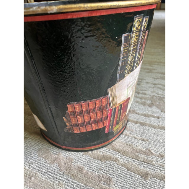 A colorful decoupage waste can bearing the label of Workman Partners, New York. It appears to be an old bucket with a hole...